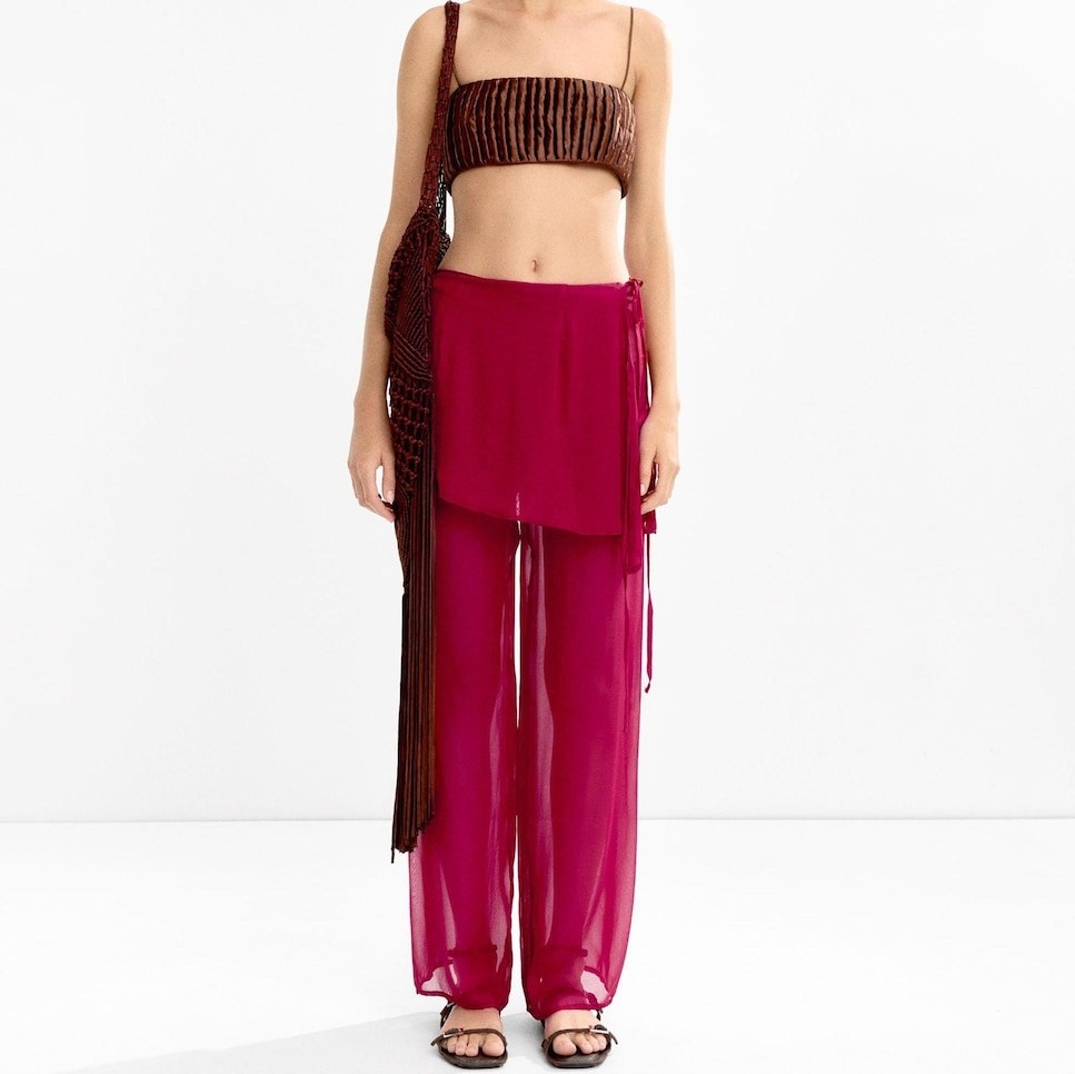 Parfois
Pantalón fluido de mujer transparente con detalle de volante corto y cordón lateral