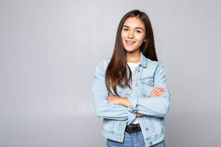 Beautiful Woman Wearing Casual Denim Jacket Over Isolated Wall Hands Together And Fingers Crossed Smiling Relaxed And Cheerful Success And Optimistic