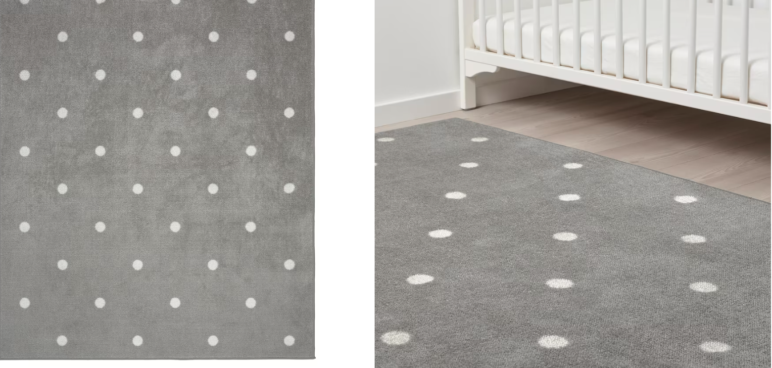 Alfombra gris con lunares blancos resistente, duradera, fácil de mantener y no se mueve del sitio. Además, tiene un tacto agradable, por lo que es perfecta para la habitación de los niños.