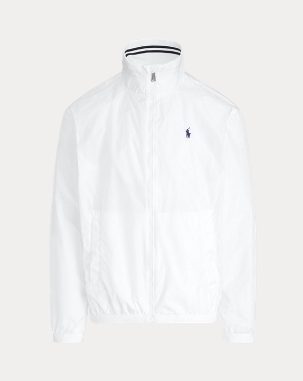 Esta chaqueta con cuello semicisne se ha confeccionado con tafetán elegante y ligero y presenta el caballo marca de la casa bordado.