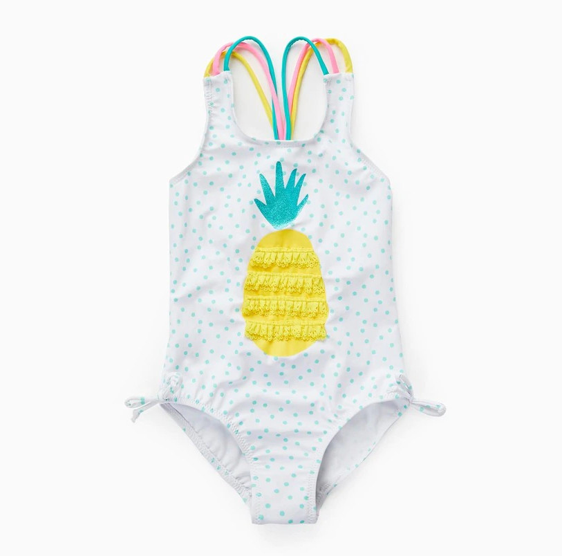 Bañador de niña en color blanco de lunares y dibujo de piña