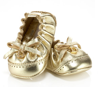 Bailarinas doradas de Dior para bebés