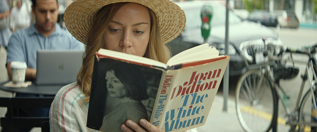 Ingrid Aubrey Plaza Reads In A Public Place In Ingrid Goes West Courtesy Of Neon