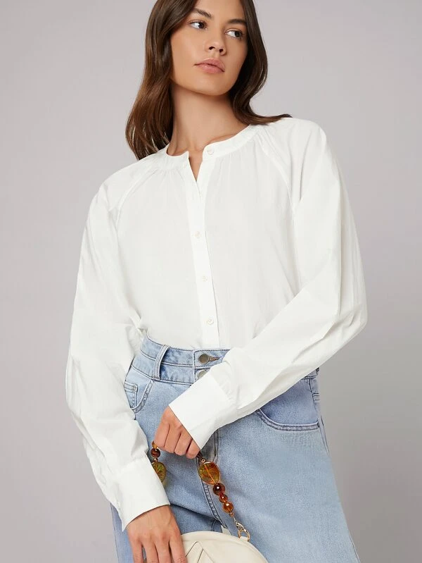 Blusa con botón irregular