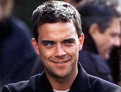 A Robbie Williams le visitan los Aliens