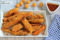 Tiras crujientes de pollo al horno rebozadas en ganchitos de queso. Receta para niños