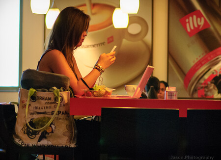 Woman Texting While Eating While Using Laptop 2