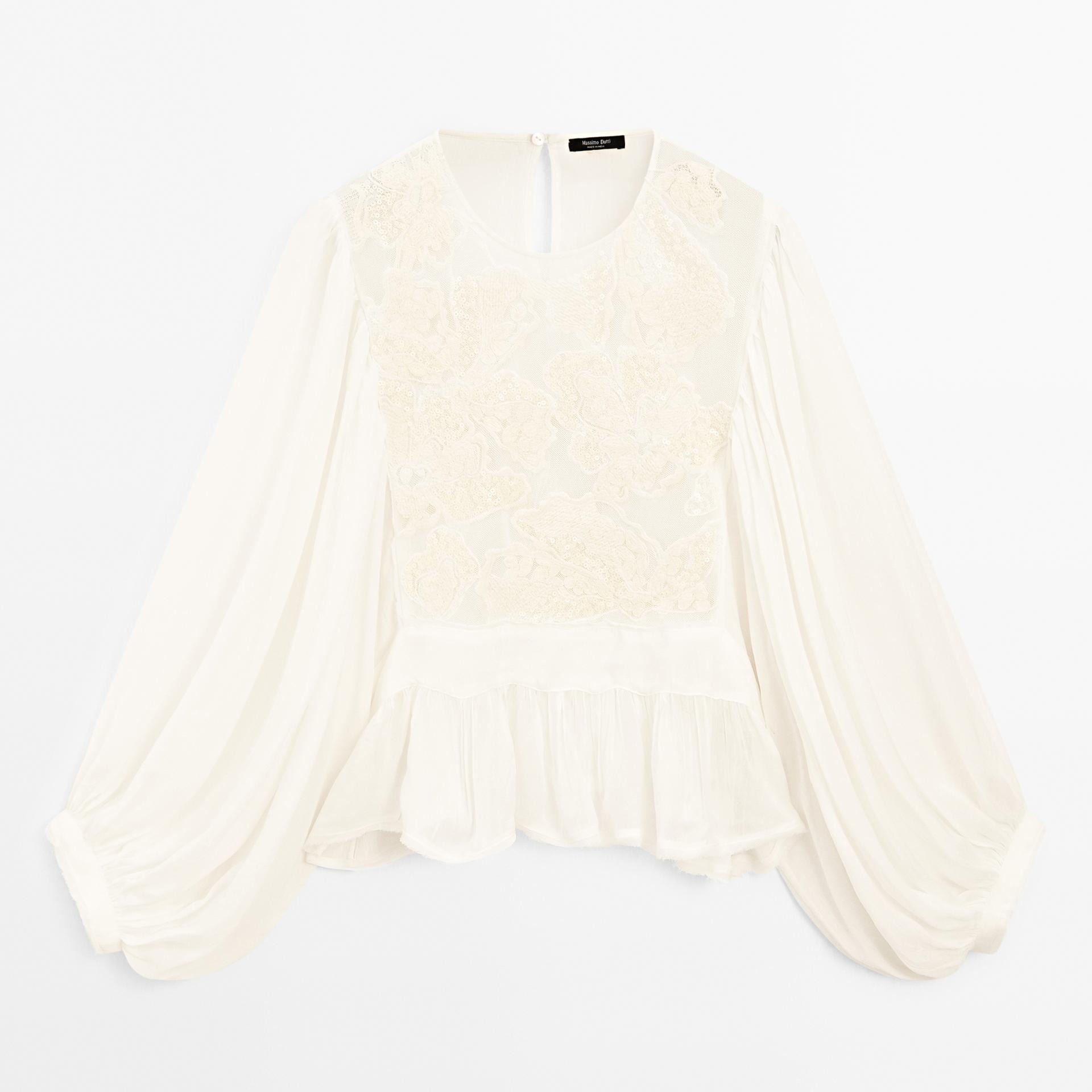 Blusa fluida bordados peplum

