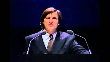 Steve Jobs feliz presentando el primer Mac Steve Jobs feliz presentando el primer Mac