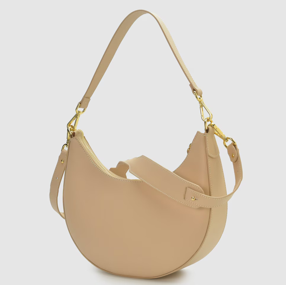 Leandra
Bolso de hombro media luna de piel color beige