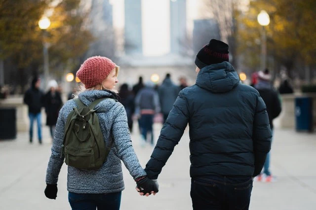 Man And Woman Holding Hands While Walking At Park 1690732 1