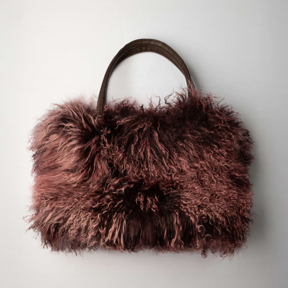 De la Roca
Bolso de multiposición grande de pelo de cordero del Tibet