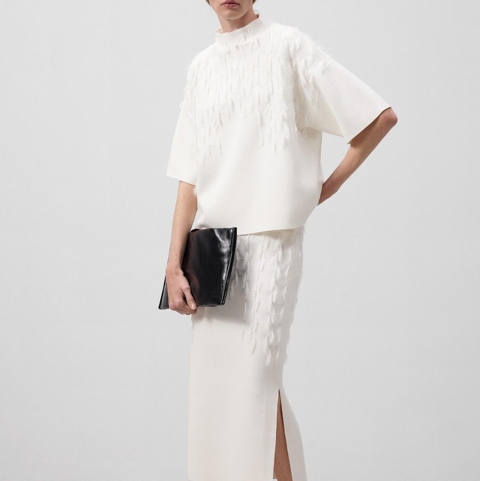 Adolfo Dominguez
Conjunto de mujer de punto con flecos