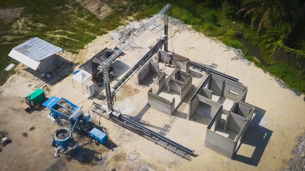 Esta enorme impresora 3D lleva la construcción de casas a otro nivel: promete hacer varios edificios a la vez y más baratos 