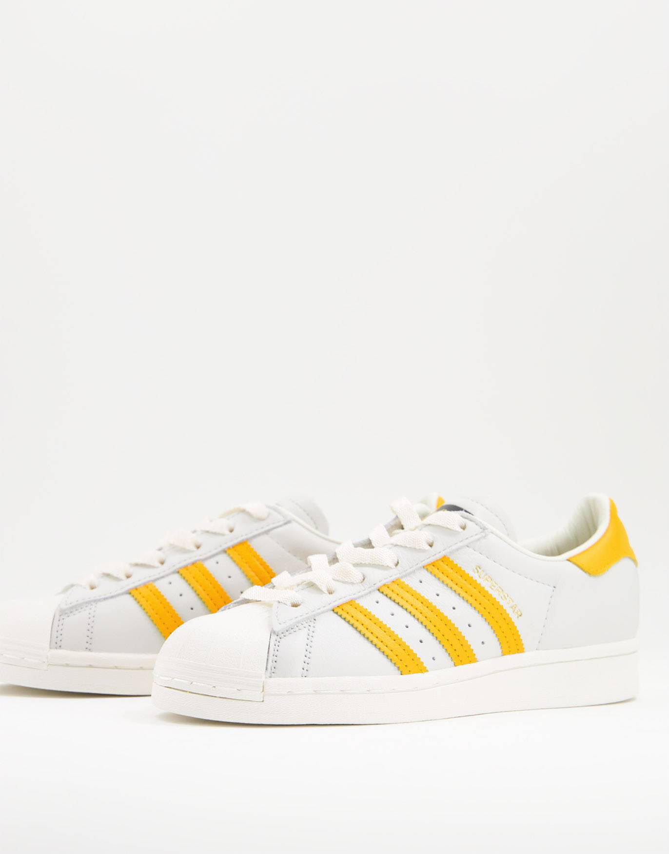 Zapatillas de deporte blancas y amarillas Superstar de adidas Originals