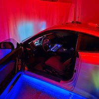 Para qué quieres una gafas de Apple Vision Pro cuando puedes tener medio coche en tu salón para jugar al Assetto Corsa