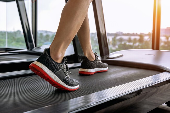 Male Feet In Sneakers Running On The Treadmill At The Gym Exercise Concept 1