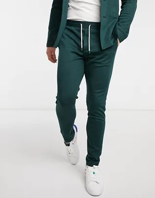 Pantalones de sastre superpitillo color verde botella de punto de ASOS DESIGN