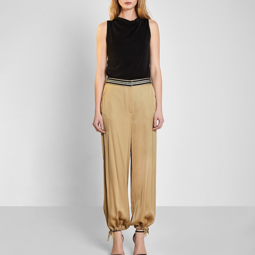 Trucco
Pantalones anchos de mujer satinados con bajo ajustable