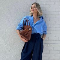 Las nuevas New Balance marrón chocolate son tan elegantes que han eclipsado a los mocasines en los looks de oficina