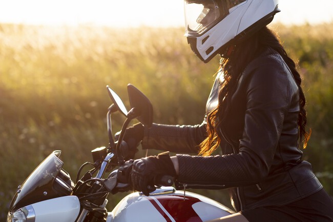 Side View Woman Riding Her Motorcycle With Helmet