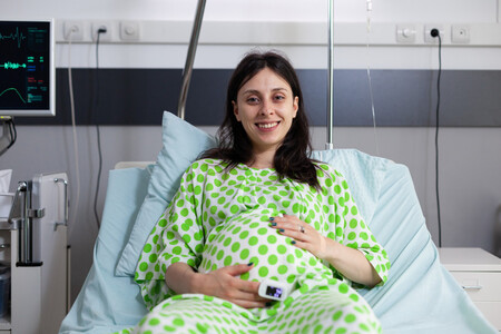 Portrait Pregnant Woman Sitting Hospital Ward Bed