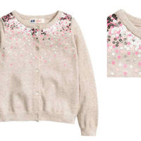 ¿Es segura la ropa que les compramos a nuestros peques? Retiran una chaqueta con lentejuelas por incumplir la normativa de piezas pequeñas