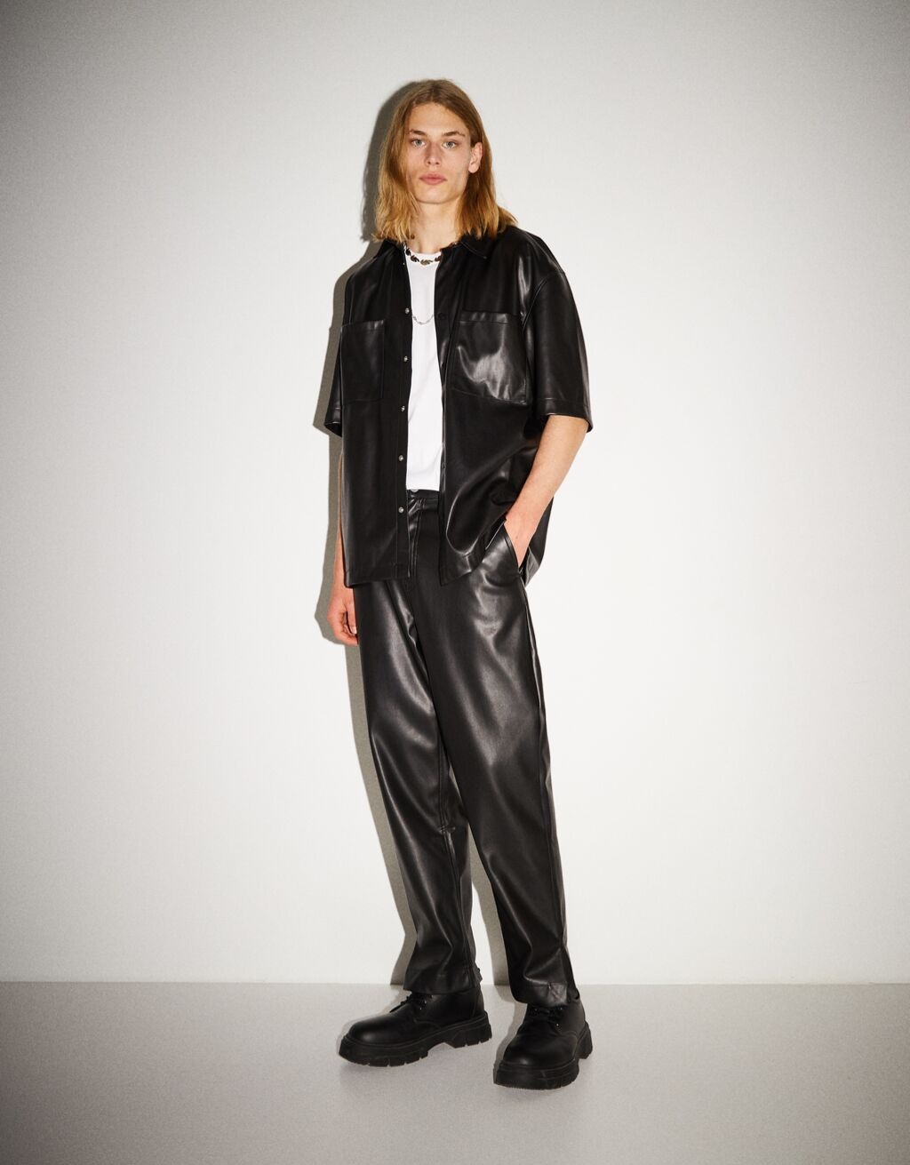 Loose faux leather trousers in black