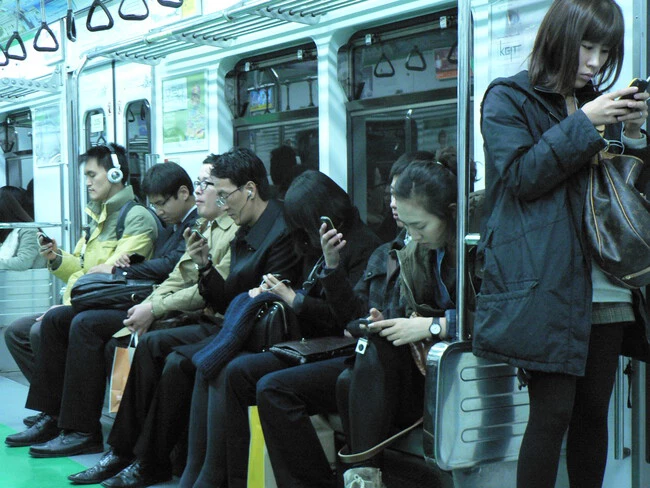 People Engaging With Their Phones On The Seoul Metro 5166351572 4e33242d3e O