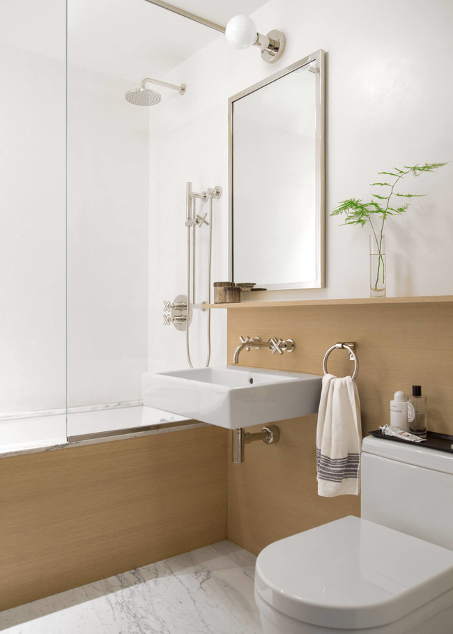 Antes y después de la reforma de un baño en Brooklyn