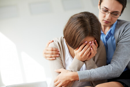 Sad Woman Crying Next To Her Therapist