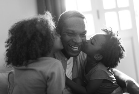 African Descent Family Home Kids Kissing Their Father