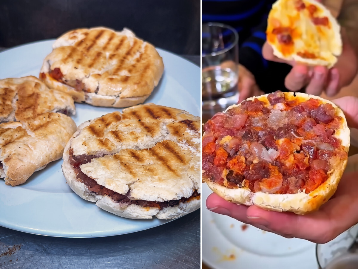 Interior del Bodegón Sarría en la calle Estafeta de Pamplona, con la barra llena de pintxos variados