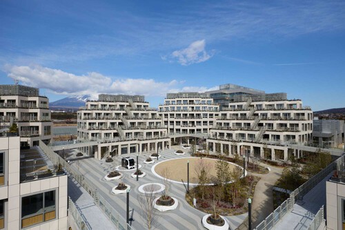 Multi-level residential complex stepped design with courtyard and mountain backdrop
