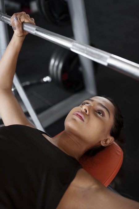 High Angle Woman Working Out With Barbell