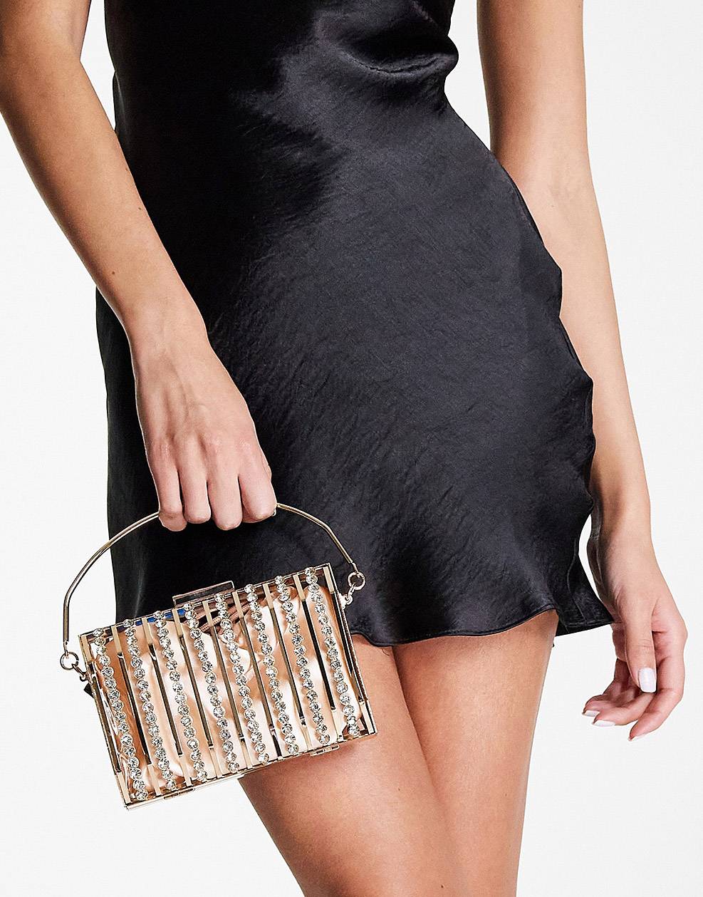 Golden clutch bag with a rectangular cage-style design with rhinestone embellishments.