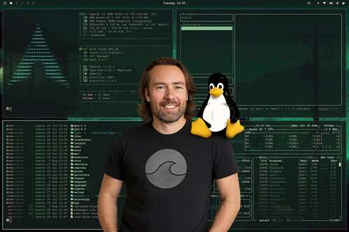 A man with shoulder-length brown hair and a beard is standing and smiling in front of a computer screen displaying multiple terminal windows with technical information and code. The background shows a large Arch Linux logo made of text characters on the left side, along with various system stats and command-line outputs. A cartoon penguin, the Linux mascot, is placed on the right side near the man's shoulder, adding a recognizable symbol of the Linux operating system.