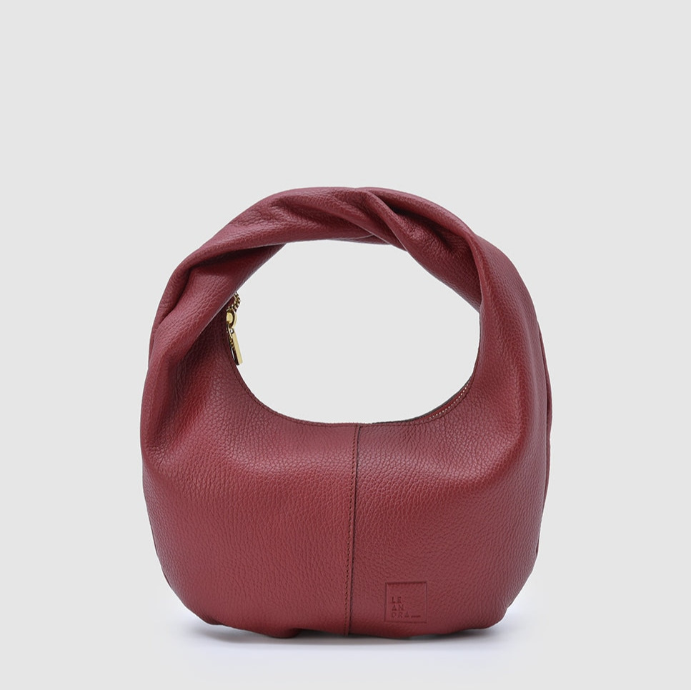 Leandra
Bolso hobo mini de mano de piel vacuna grano con cremallera