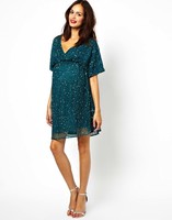Moda fiesta para embarazadas: ropa premamá muy brillante 
