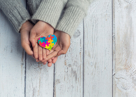 Closeup On Two Young Lovers Holding Hands At Table