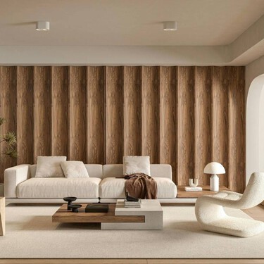 Así evitan los interioristas que las mantas del sofá desordenen el salón (y se vea siempre recogido) 