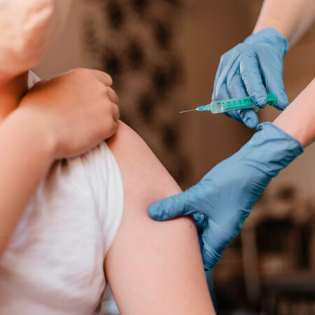 Doctor Giving Child Vaccine While Wearing Gloves