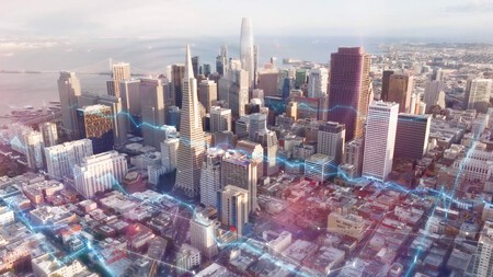 Cityscape With Data Flowing Between Buildings 1600x900