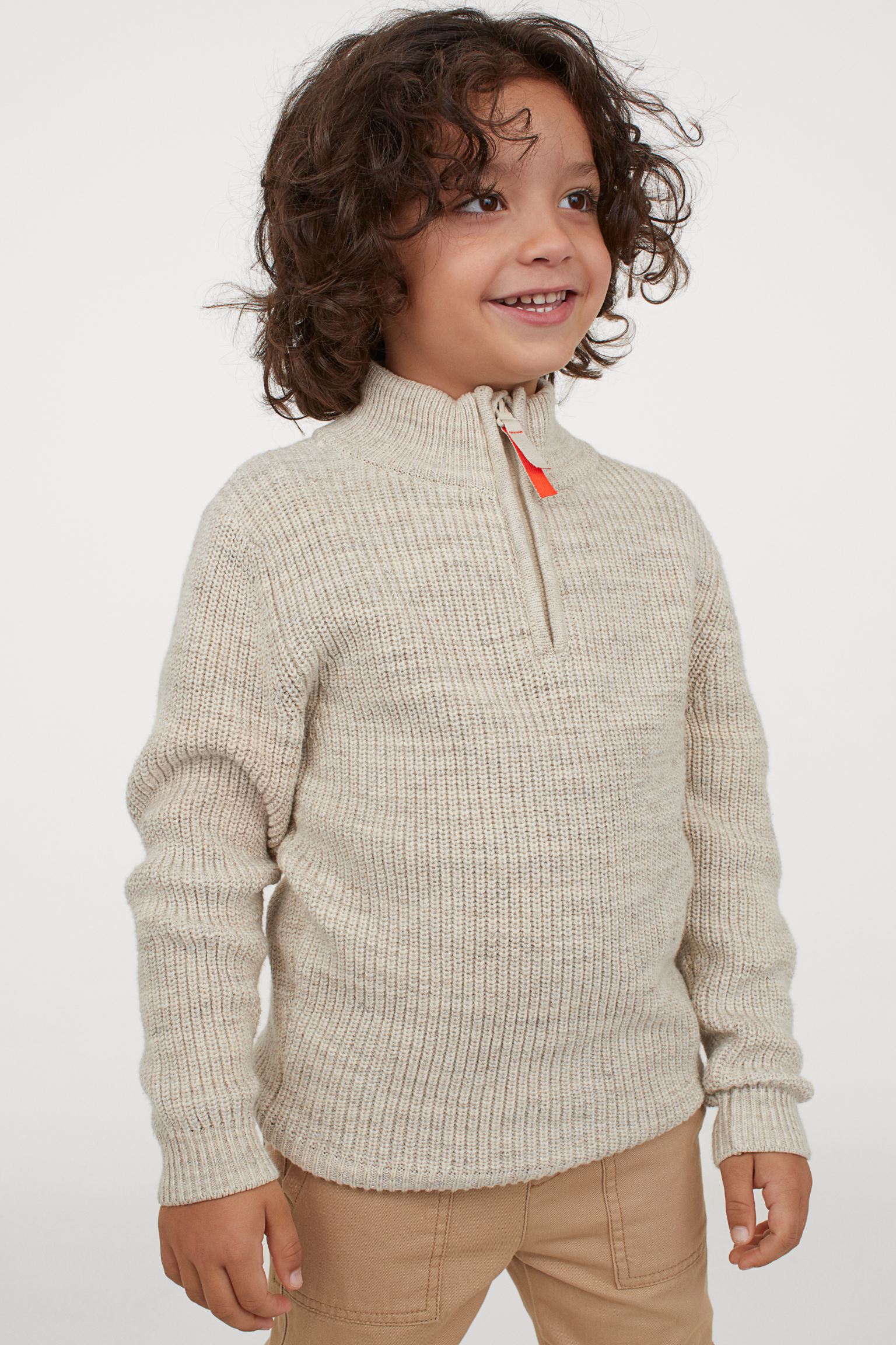 Jersey de punto beige con cremallera