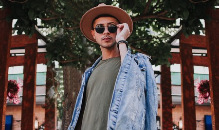 Man Wearing Gray Shirt With Blue Denim Jacket Holding His 2087791