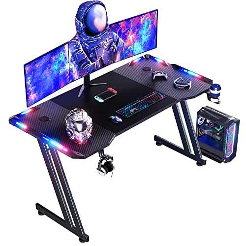 HLONONE 120 × 60cm LED Mesa Gaming, Escritorio Gaming de Fibra de Carbono Ergonómicas, Escritorio Gamer con Portavasos y Gancho para Auriculares, Negro