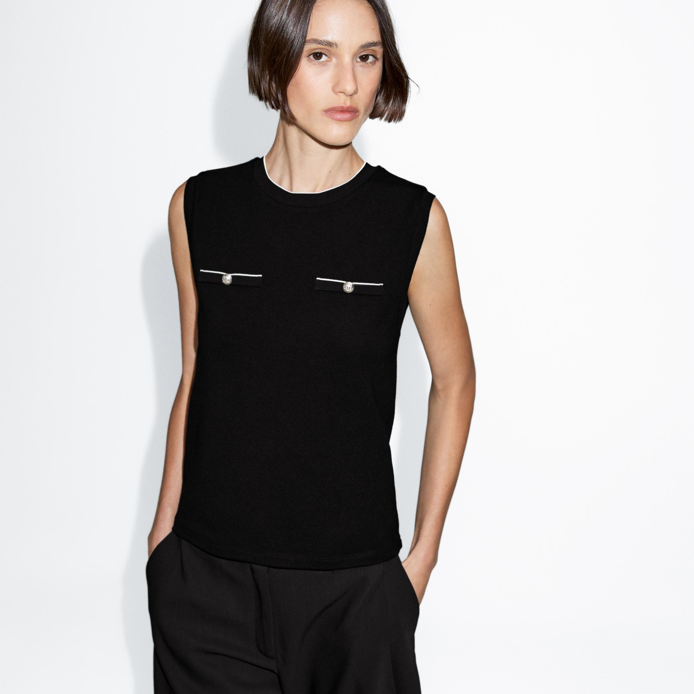 Top sin mangas detalle bolsillos