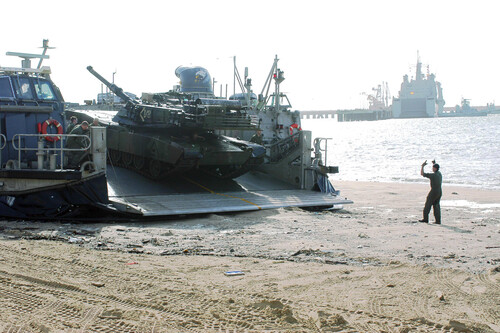 Us Navy 031001 N 2964h 002 A Marine From Uss Nashville Lpd 13 Unloads A M1 A1 Abrams Main Battle Tank From Landing Craft Air Cushioned Lcac Vehicle At U S Naval Station Rota Spain