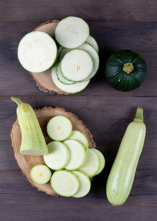 Top View Sliced Zucchinis Stubs Dark Wooden Table 1
