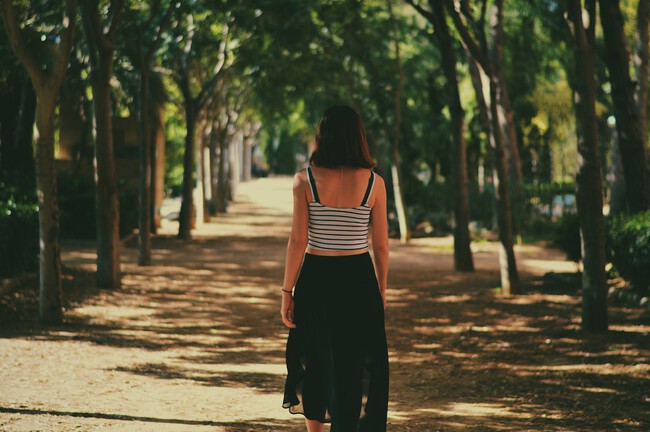 Woman Walking Down Path Unsplash 2